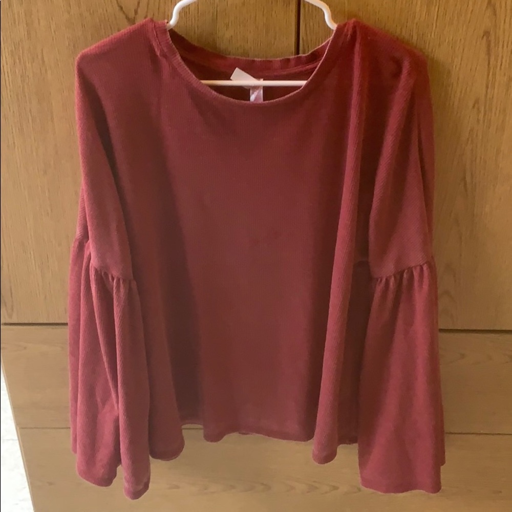 red wide sleeved top
